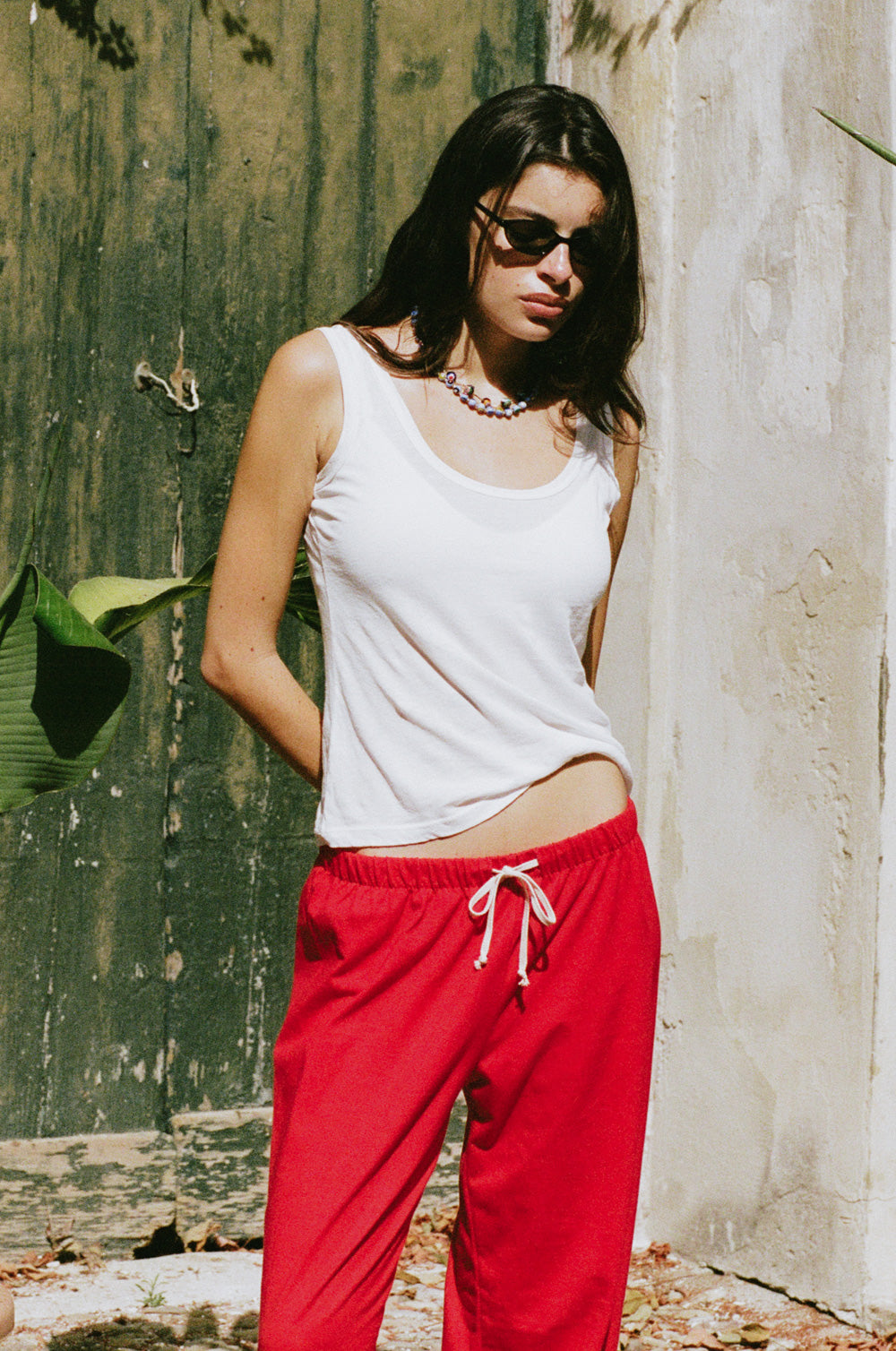 the relaxed sweatpant in red jersey styled with the feather scoop tank in white sheer cotton - the lady & the sailor