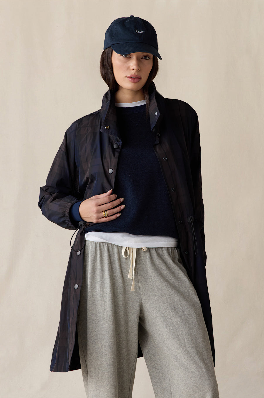 Relaxed Fleece Sweatshirt in indigo, styled with the Anorak Jacket in midnight tartan, Relaxed Pocket Sweatpant in heather grey terry, Shrunken BF Tee in white and Lady Classic Cap in navy - the lady & the sailor