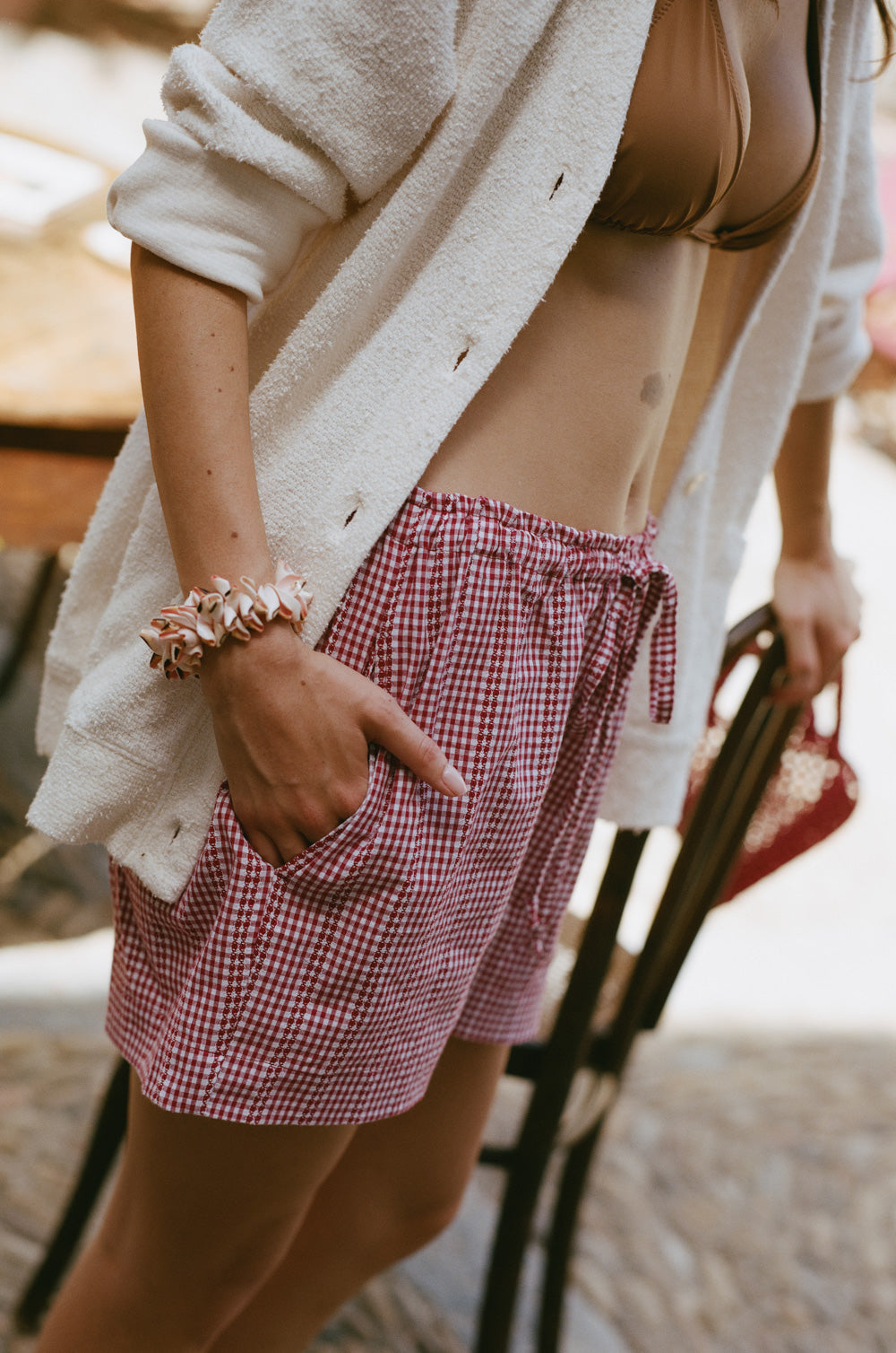 The Lido short in Rosso styled with the classic pocket cardi in creme boucle - the lady & the sailor
