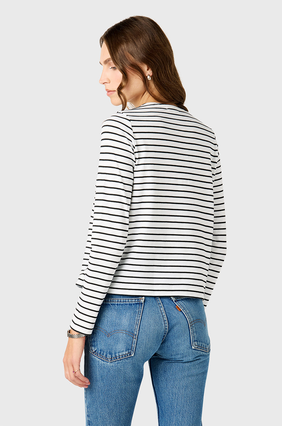 Model wearing The Lady & The Sailor Bateau Tee in Black Stripe.