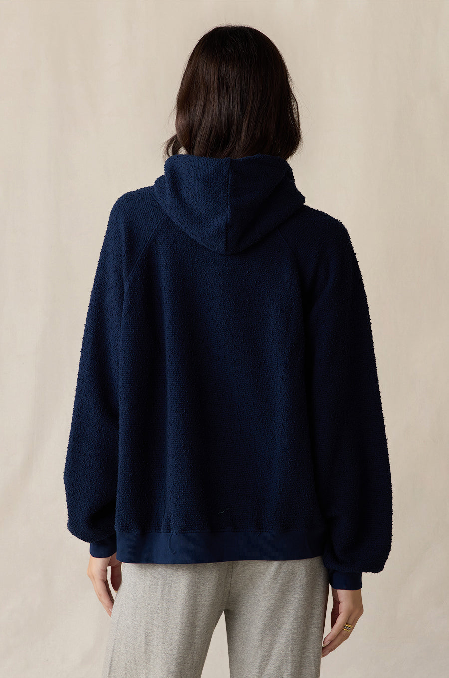 Tomboy Hoodie in indigo bouclé styled with the French Flare Pant in heather grey - the lady & the sailor