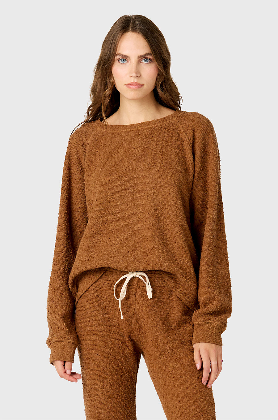 Model wearing the lady & the sailor's Brentwood Sweatshirt in Praline Bouclé.
