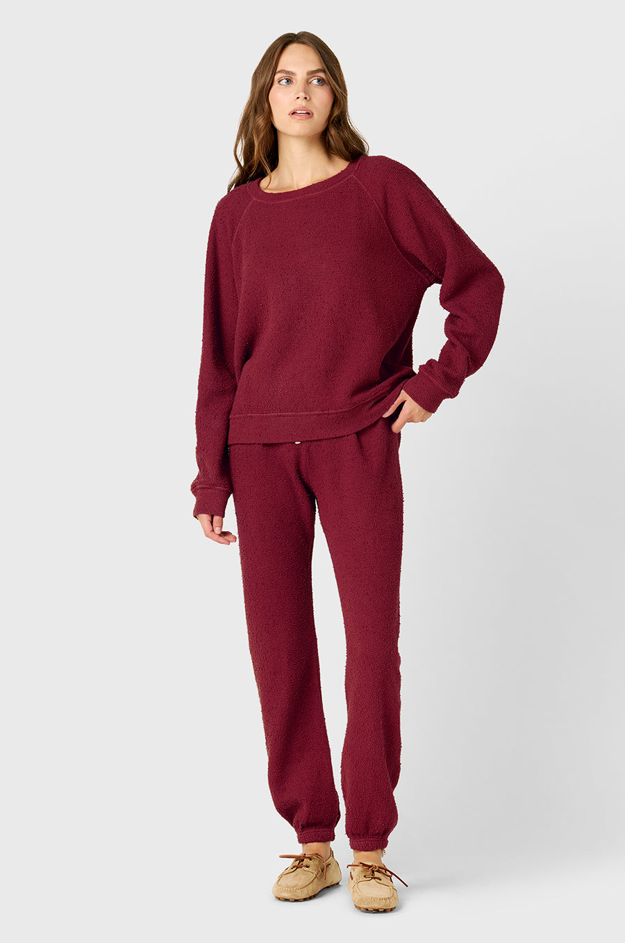 Model wearing The Lady & The Sailor Brentwood Sweatshirt in Ruby Bouclé and the Full Length Vintage Sweatpant in Ruby Bouclé.