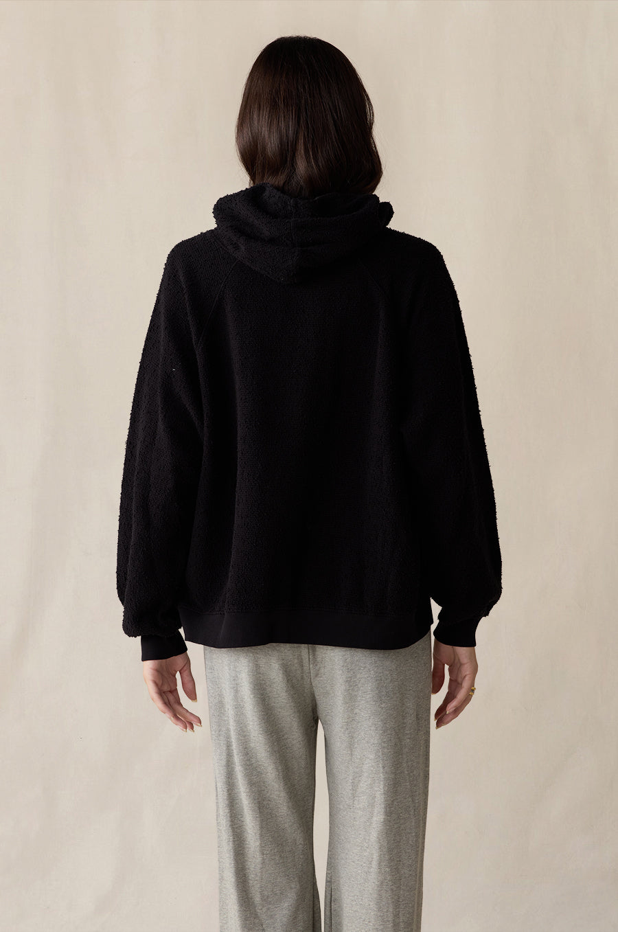 Tomboy Hoodie in black bouclé styled with the French Flare Pant in heather grey - the lady & the sailor