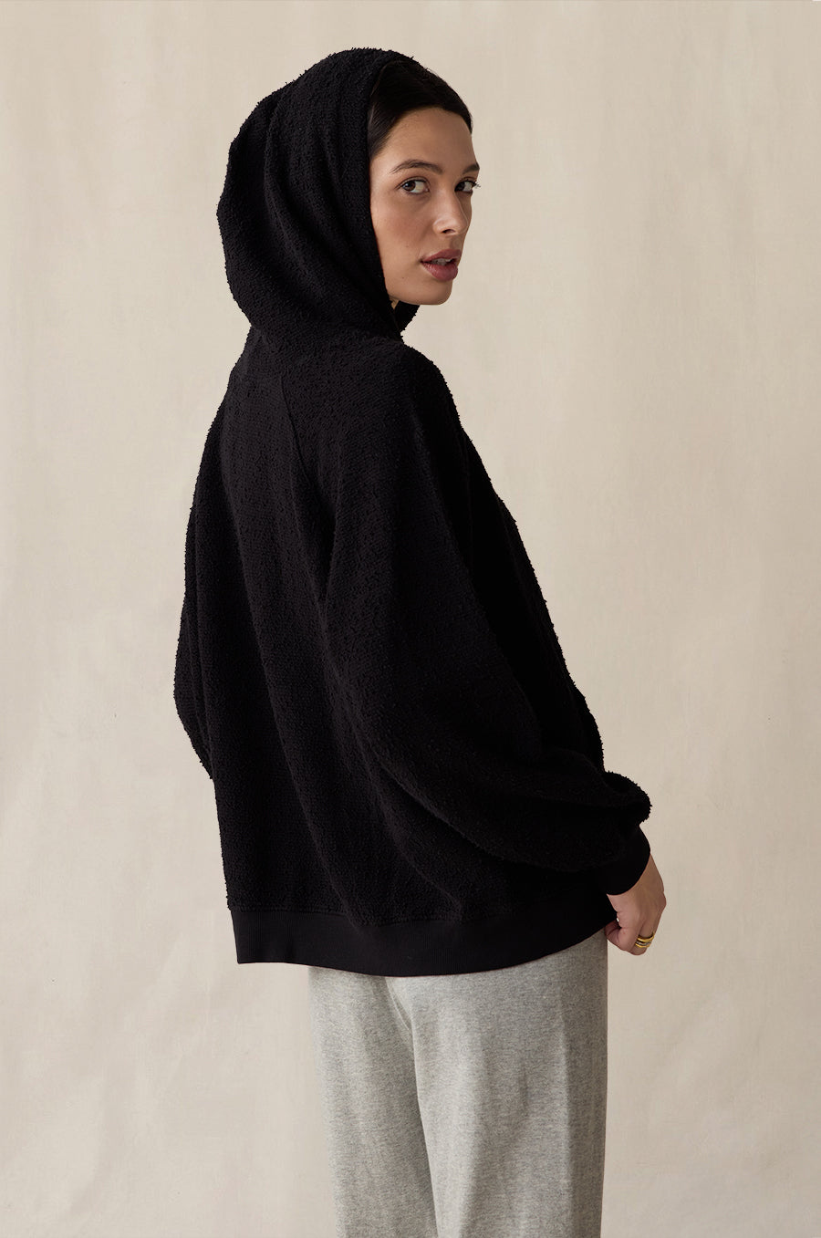 Tomboy Hoodie in black bouclé styled with the French Flare Pant in heather grey - the lady & the sailor