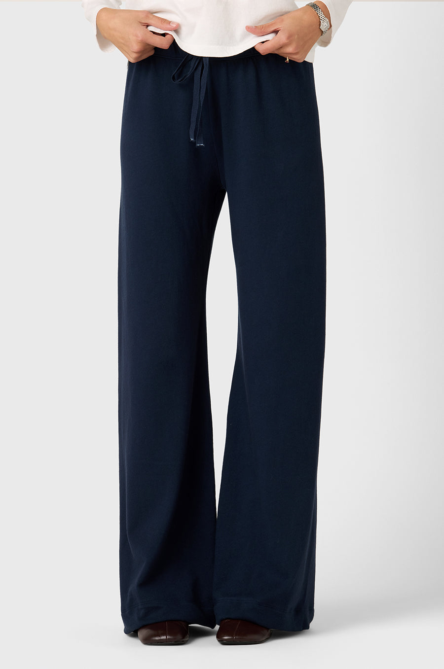 Model wearing The Lady & The Sailor Polo Sweatshirt in Vanilla Organic Cotton and the Wide Leg Pant in Deep Organic Cotton.