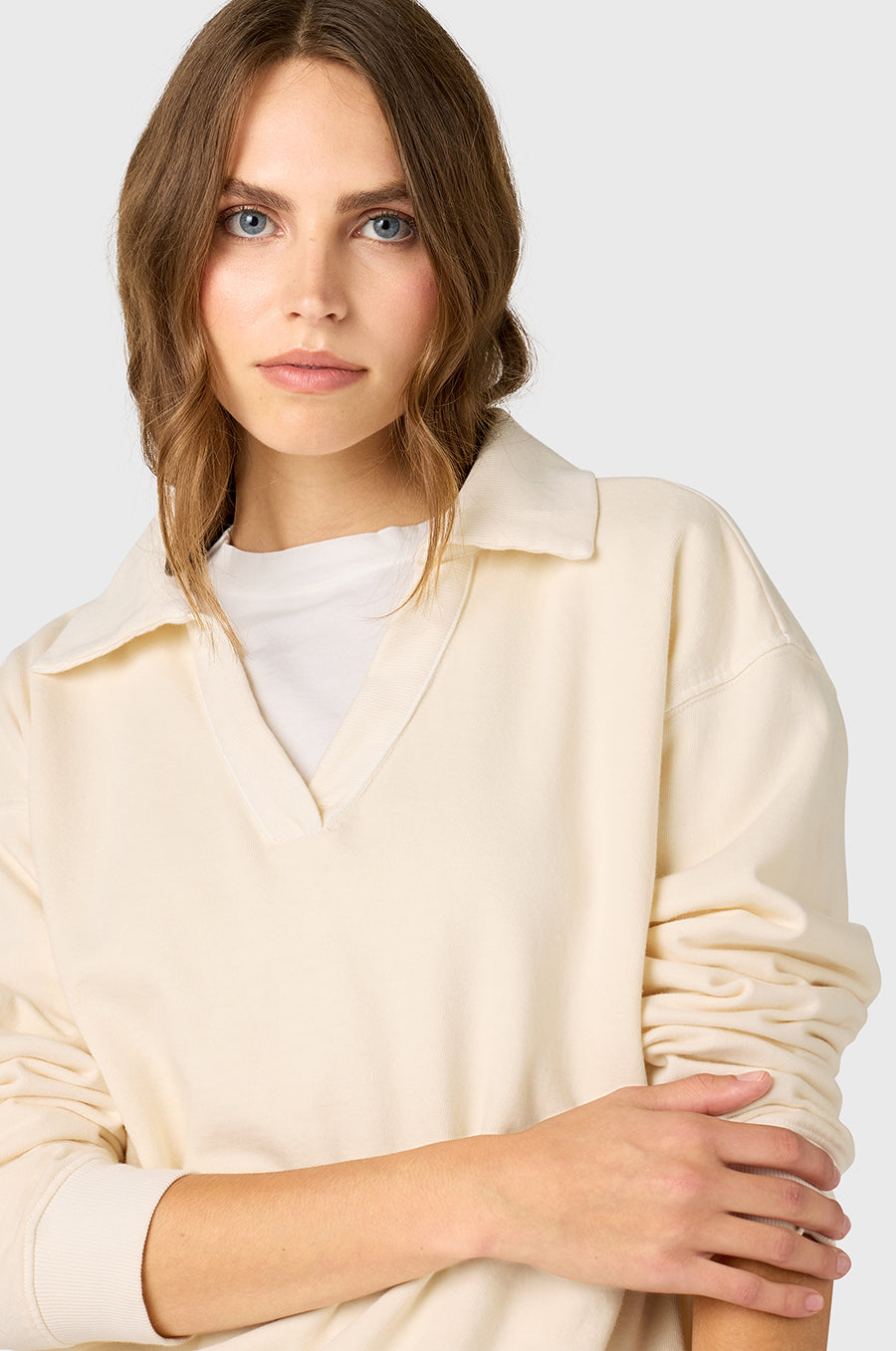Model wearing The Lady & The Sailor Polo Sweatshirt in Vanilla Organic Cotton.