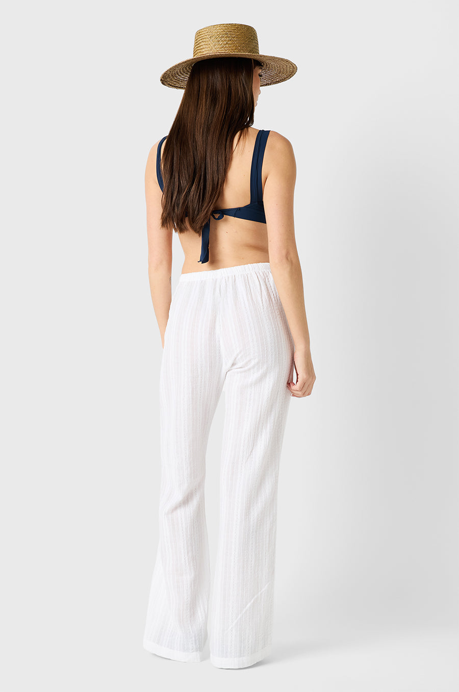 Brunette model wearing the lady & the sailor Beach Pant in White Beach Stripe