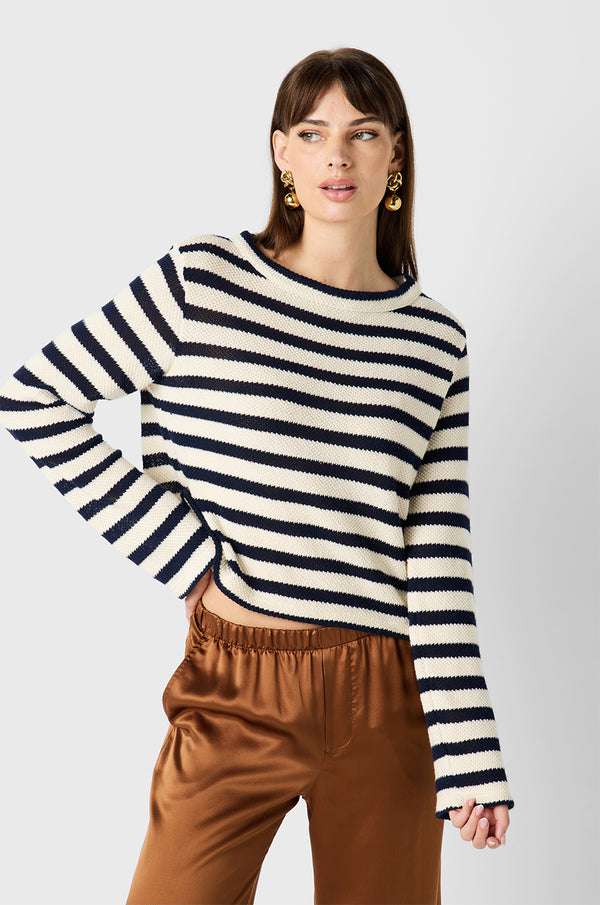 Brunette Model wearing the lady & the sailor Seaside Sweater in Riviera Knit Stripe