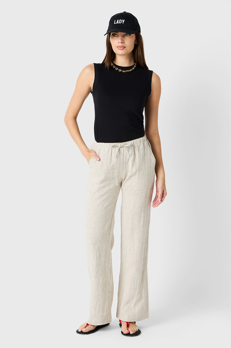 Brunette Model wearing the lady & the sailor Relaxed Pant in Natural Linen