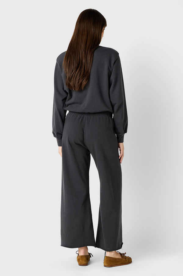 Brunette Model wearing the lady & the sailor French Flare Pant in Slate Organic Cotton