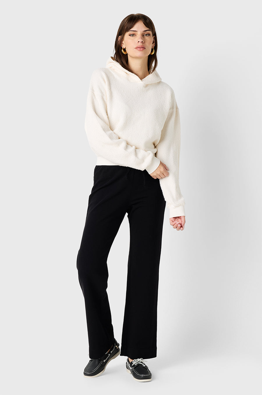 Brunette Model wearing the lady & the sailor Hoodie in Vanilla Bouclé