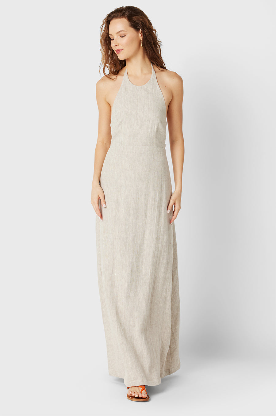 Brunette Model wearing the lady & the sailor Lilou Dress in Natural/White Linen.