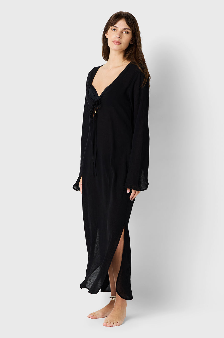 Brunette Model wearing the lady & the sailor Mia Dress in Black Cotton Voile