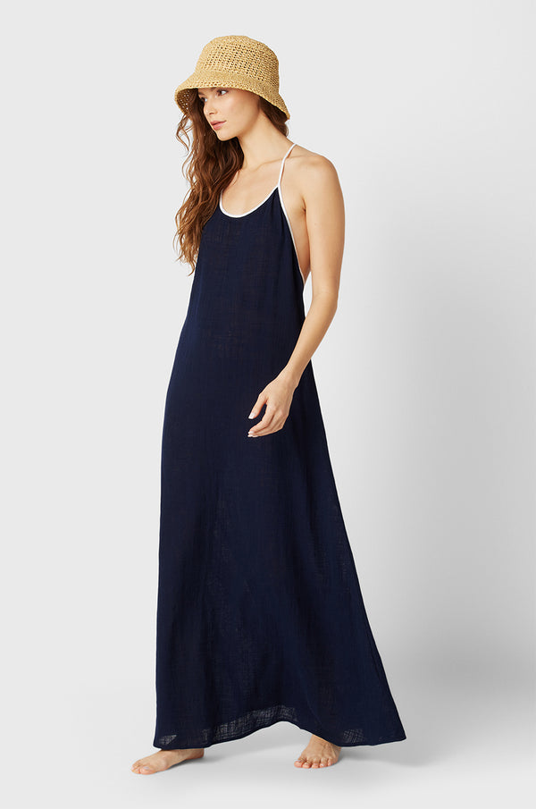 Brunette Model wearing the lady & the sailor Mila Dress in Navy/White Gauze.