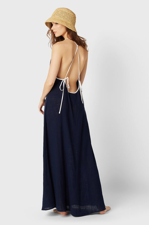 Brunette Model wearing the lady & the sailor Mila Dress in Navy/White Gauze.