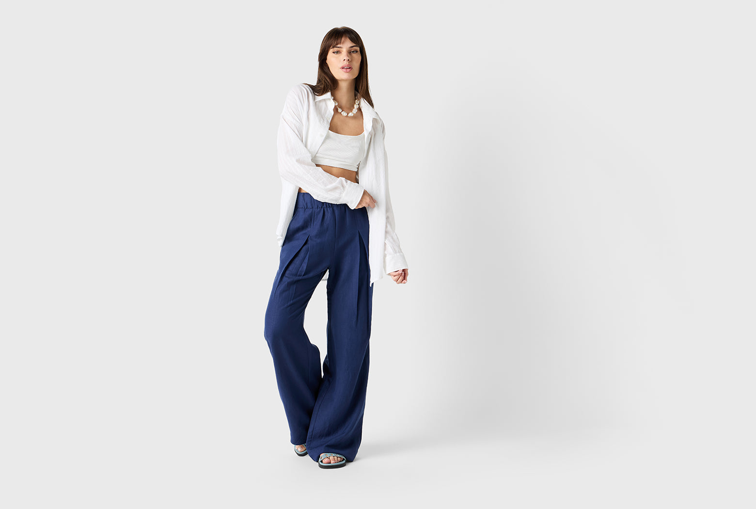 Brunette Model wearing the lady & the sailor Sunday Shirt in White Pointelle Stripe