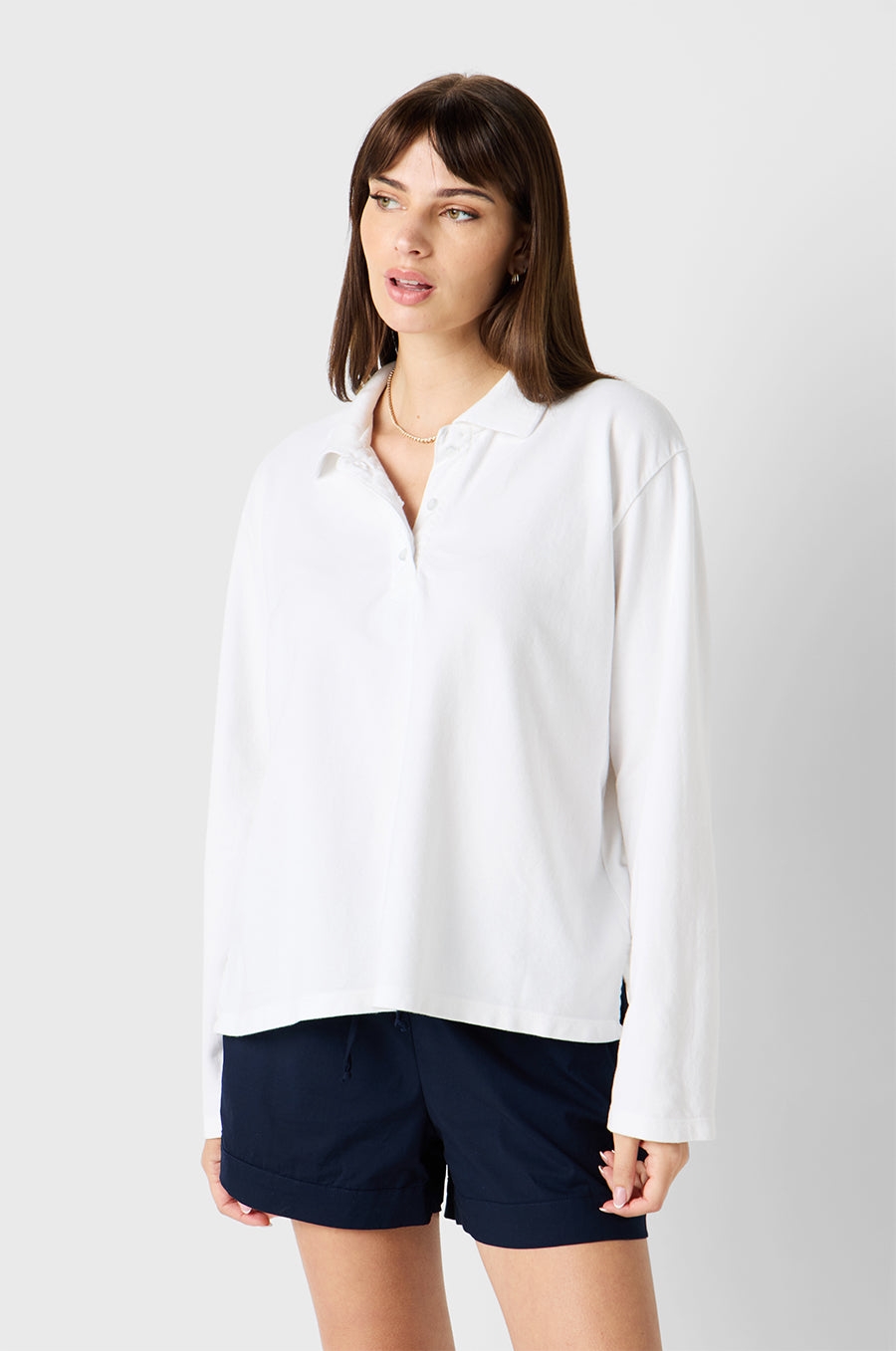 Brunette Model wearing the lady & the sailor BF Polo in White Twill Cotton