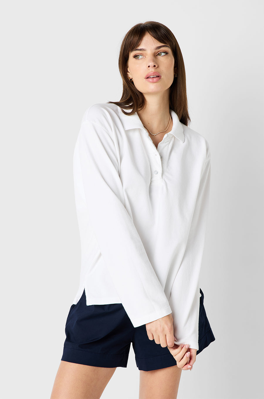 Brunette Model wearing the lady & the sailor BF Polo in White Twill Cotton