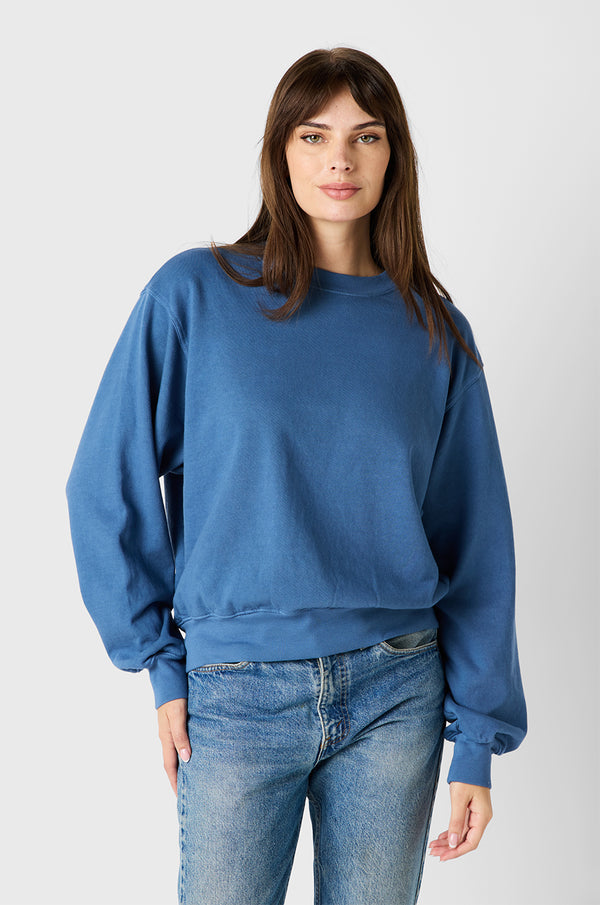 Brunette Model wearing the lady & the sailor Relaxed Sweatshirt in Sea Blue Organic Cotton