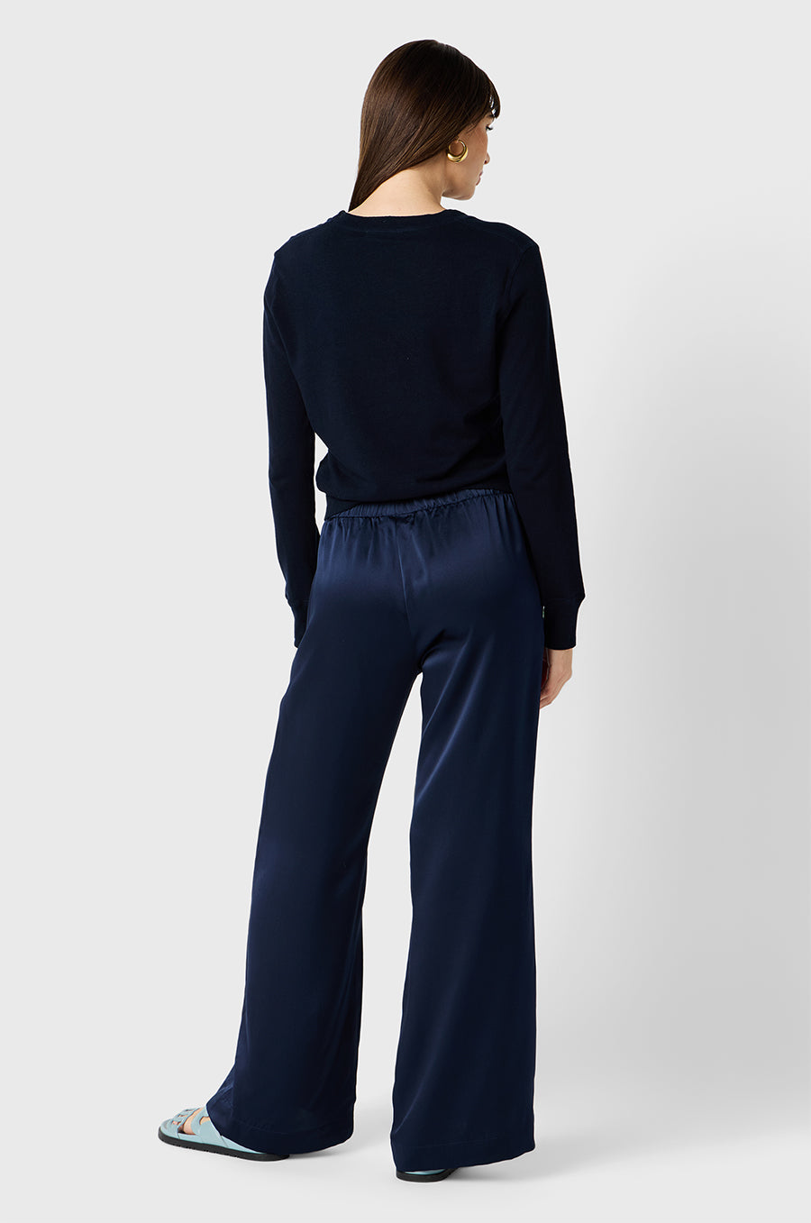 Brunette model wearing the lady & the sailor Wide Leg Pant in Navy Silk