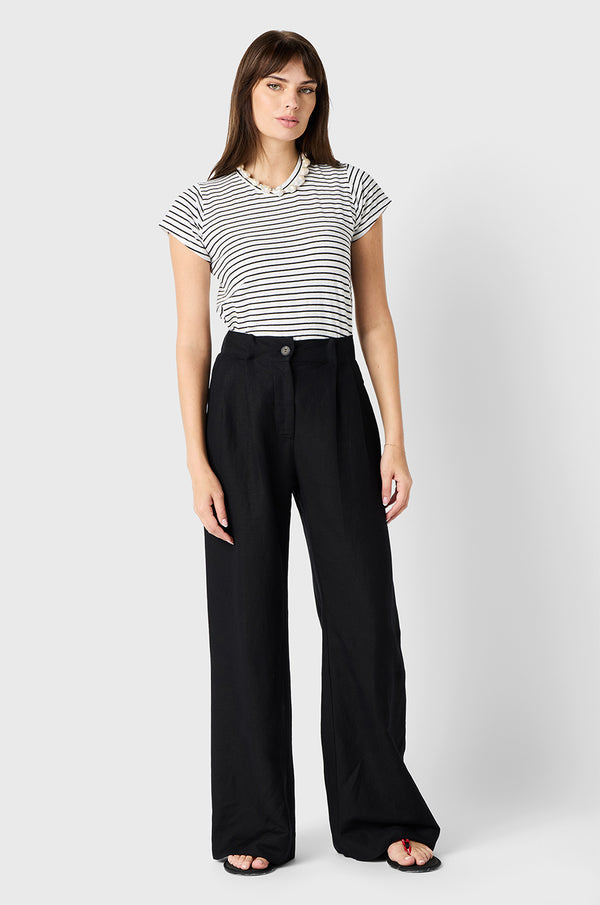 Brunette Model wearing the lady & the sailor Slouchy High Waisted Trouser in Black