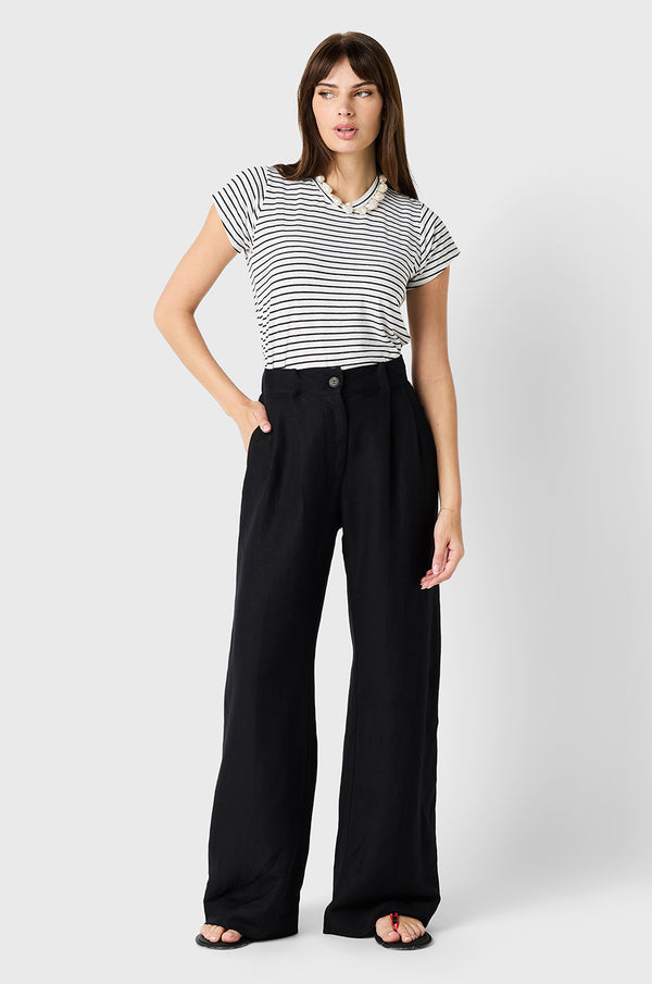 Brunette Model wearing the lady & the sailor Slouchy High Waisted Trouser in Black