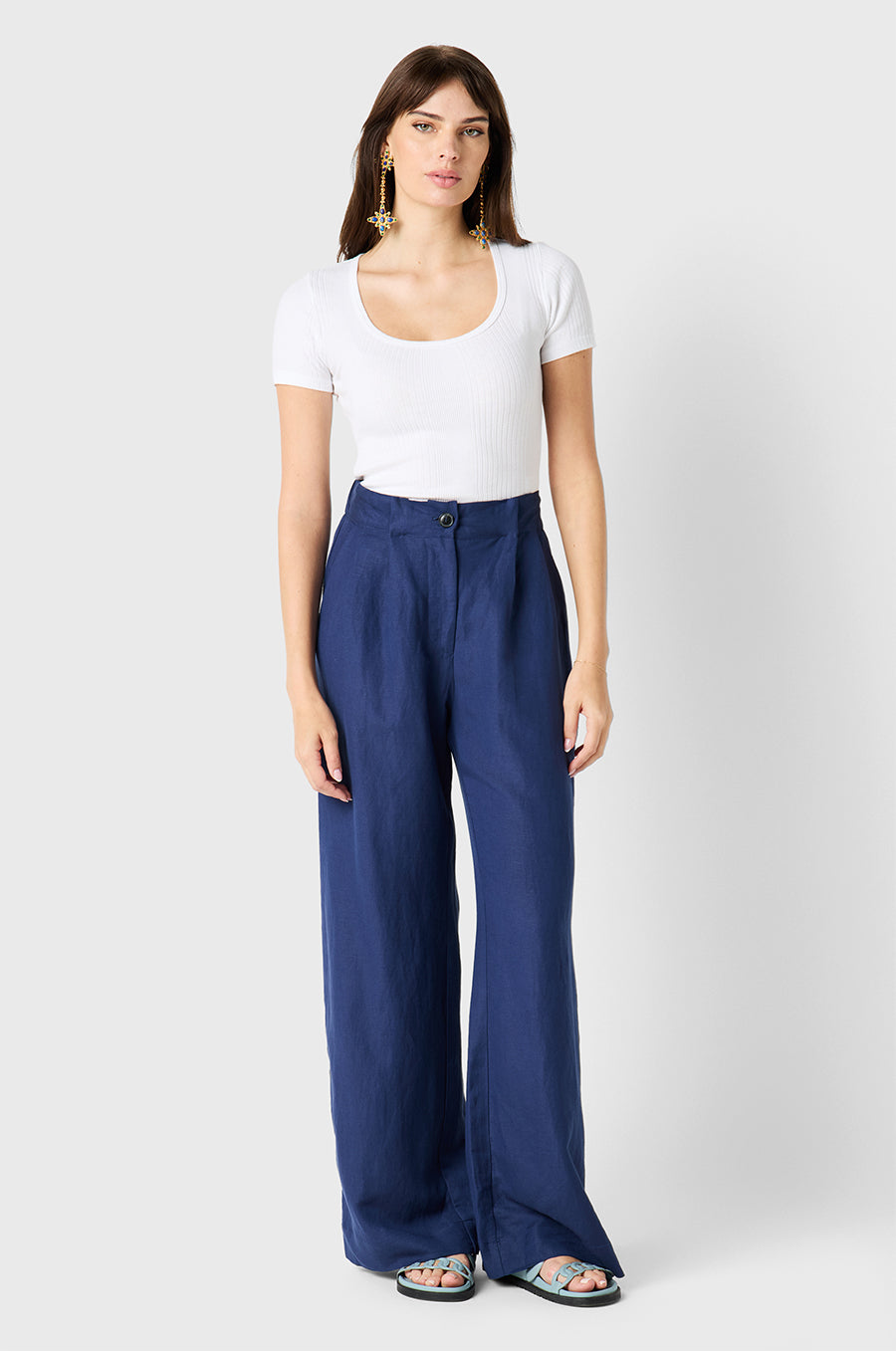 Brunette Model wearing the lady & the sailor Slouchy High Waisted Trouser in Nautical Navy