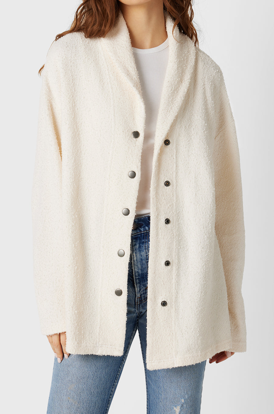 Brunette Model wearing the lady & the sailor Snap Cardi in Vanilla Boucle.