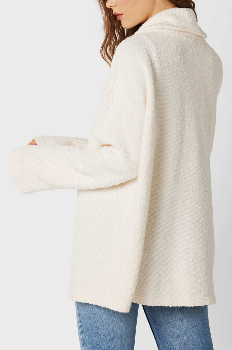 Brunette Model wearing the lady & the sailor Snap Cardi in Vanilla Boucle.