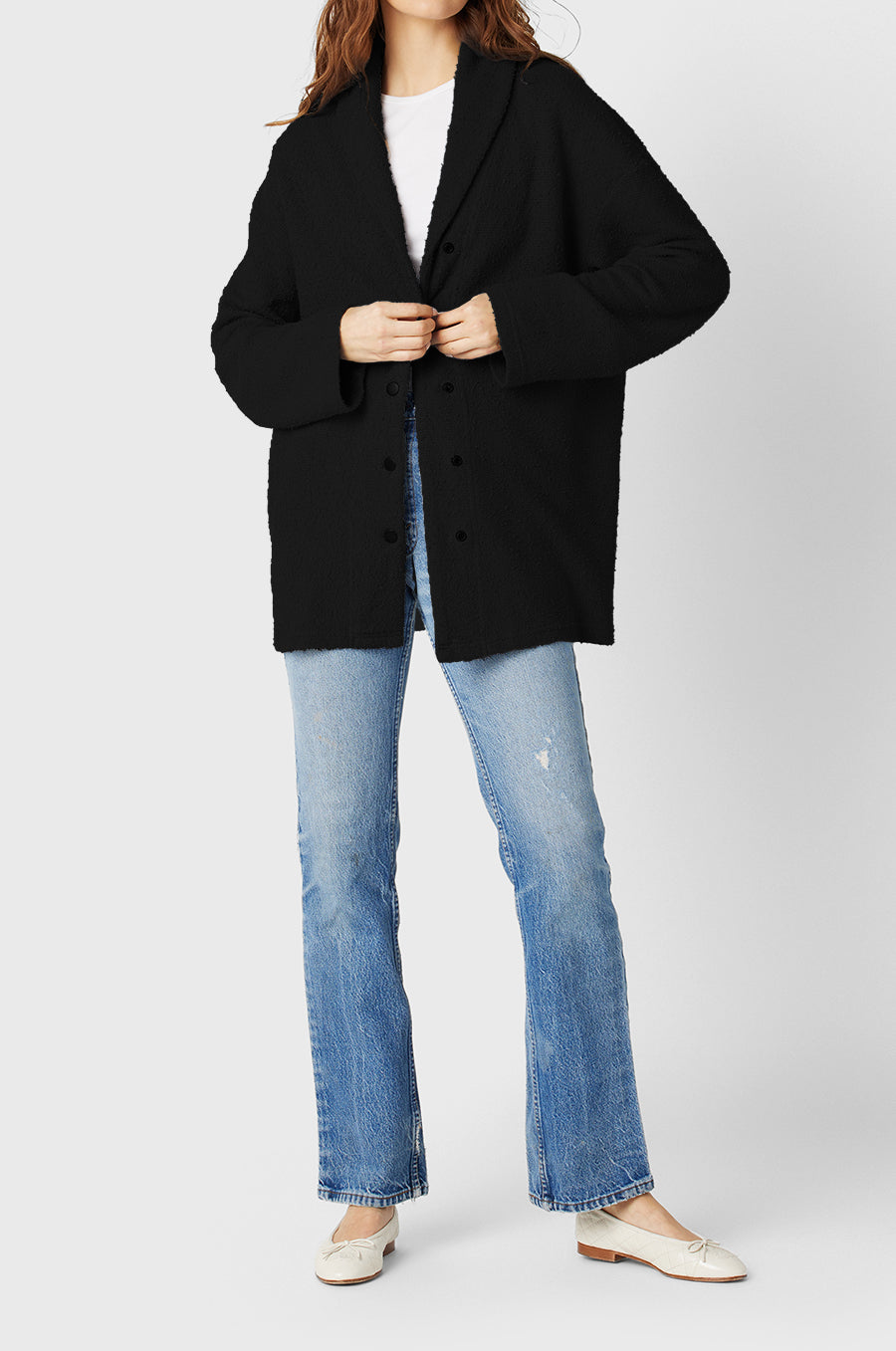 Model wearing the lady & the sailor Snap Cardi in Black Bouclé.