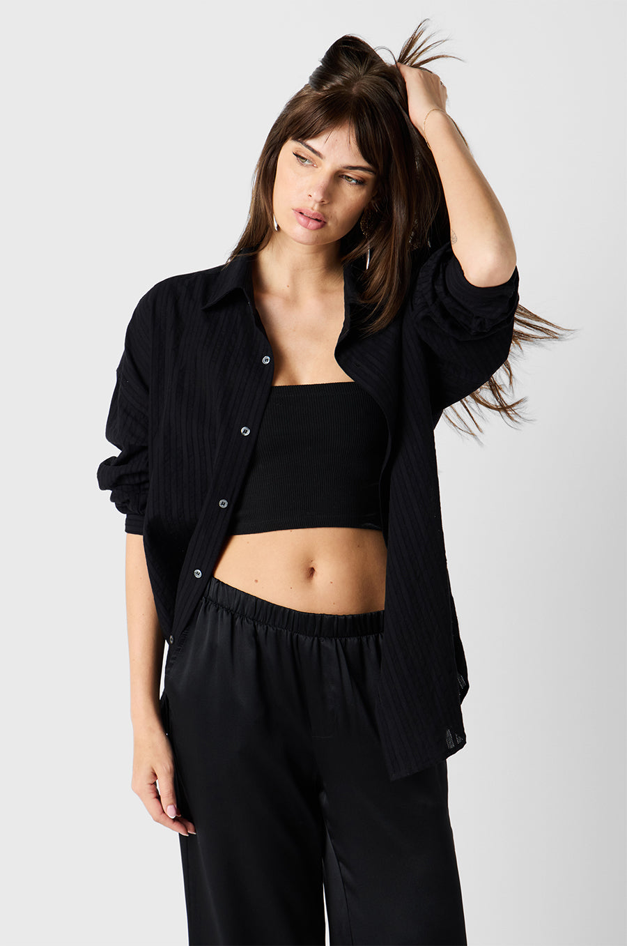 Brunette model wearing the lady & the sailor Wide Leg Pant in Black Silk