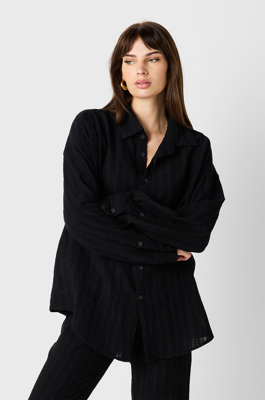 Brunette Model wearing the lady & the sailor Sunday Shirt in Black Beach Stripe
