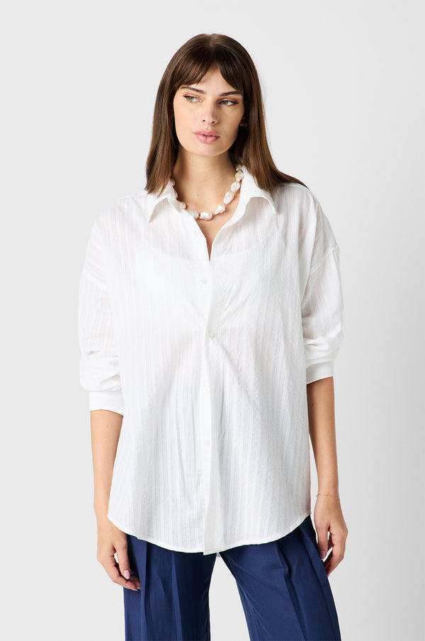 Brunette Model wearing the lady & the sailor Sunday Shirt in White Pointelle Stripe