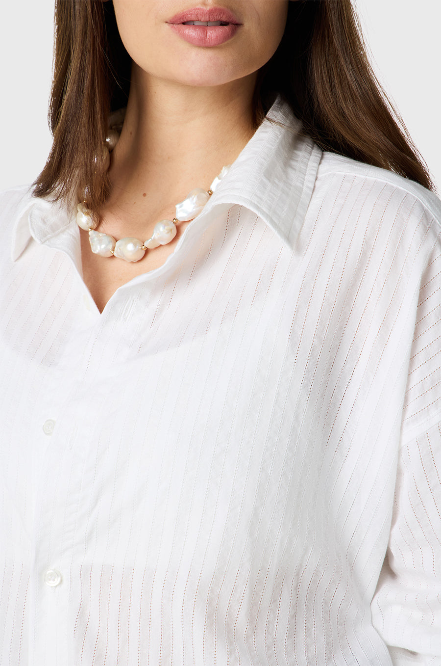 Brunette Model wearing the lady & the sailor Sunday Shirt in White Pointelle Stripe