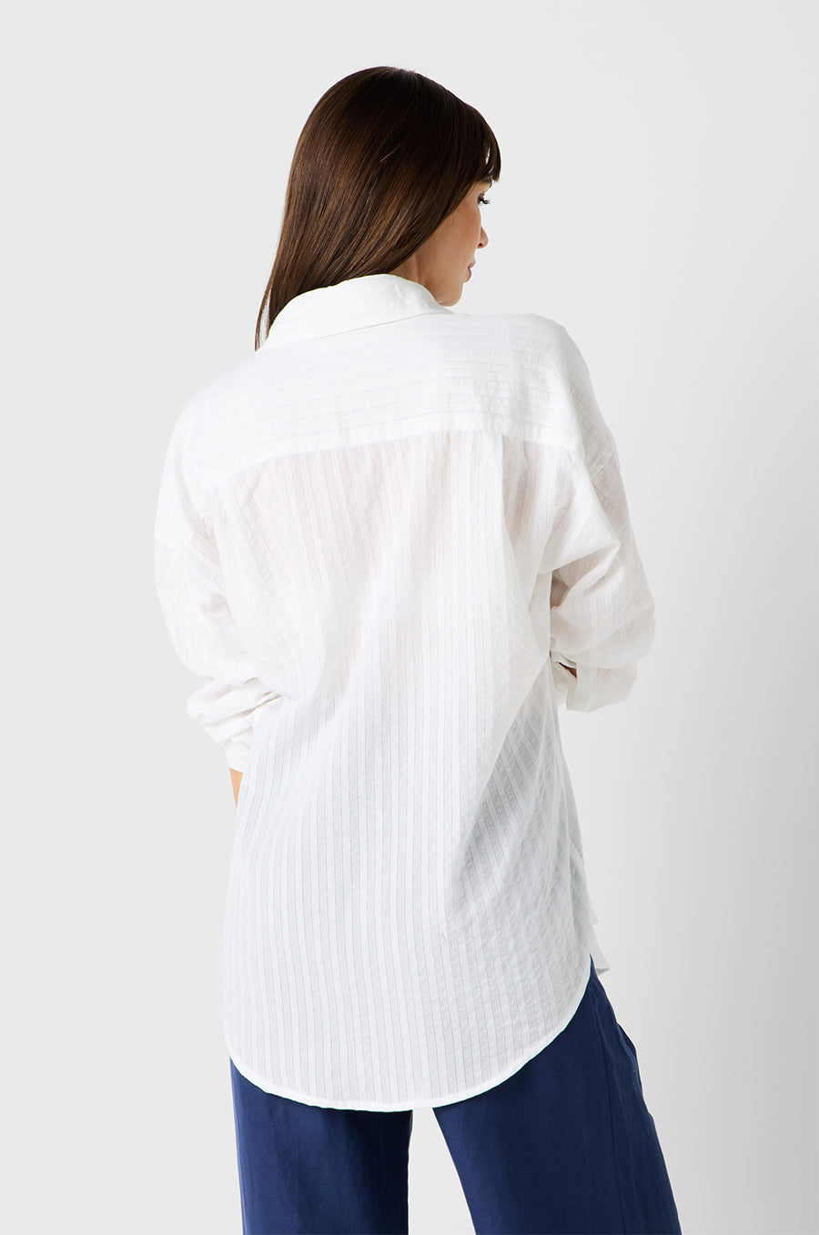 Brunette Model wearing the lady & the sailor Sunday Shirt in White Pointelle Stripe