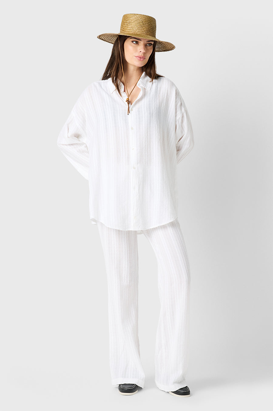Brunette model wearing the lady & the sailor Beach Pant in White Beach Stripe
