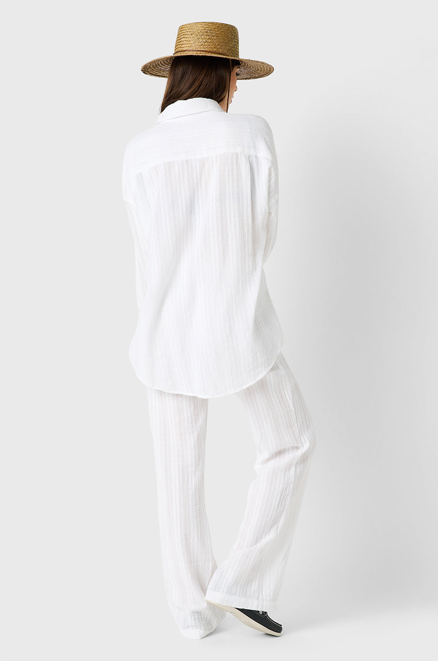 Brunette model wearing the lady & the sailor Beach Pant in White Beach Stripe