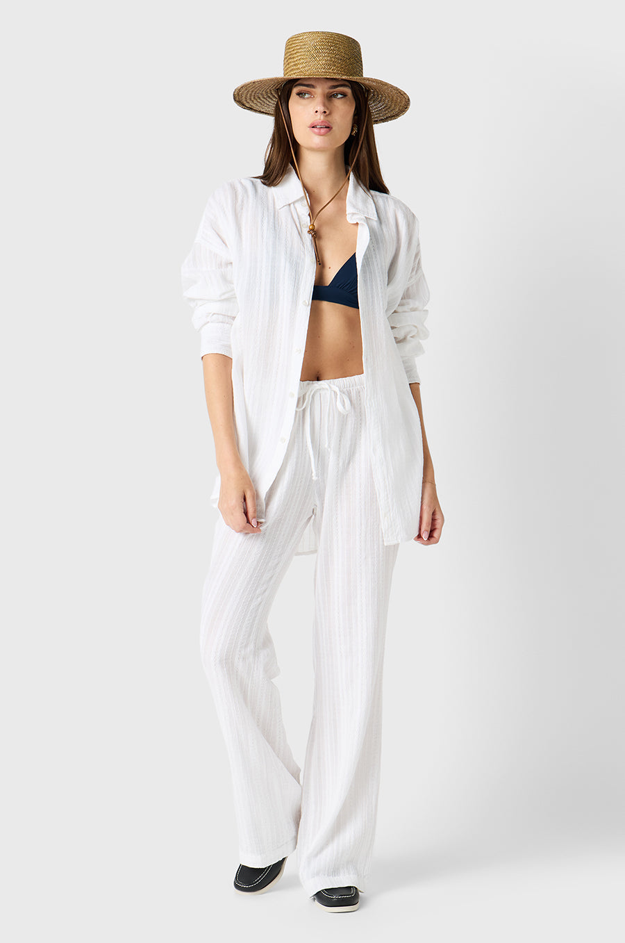 Brunette model wearing the lady & the sailor Beach Pant in White Beach Stripe