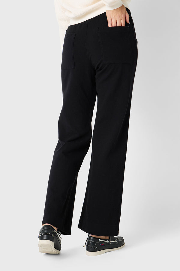 Brunette Model wearing the lady & the sailor Pocket Straight Leg Pant in Black Twill Cotton