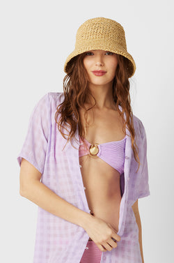 Model wearing the Ferruccio Vecchi Raffia Bucket Hat in Natural.