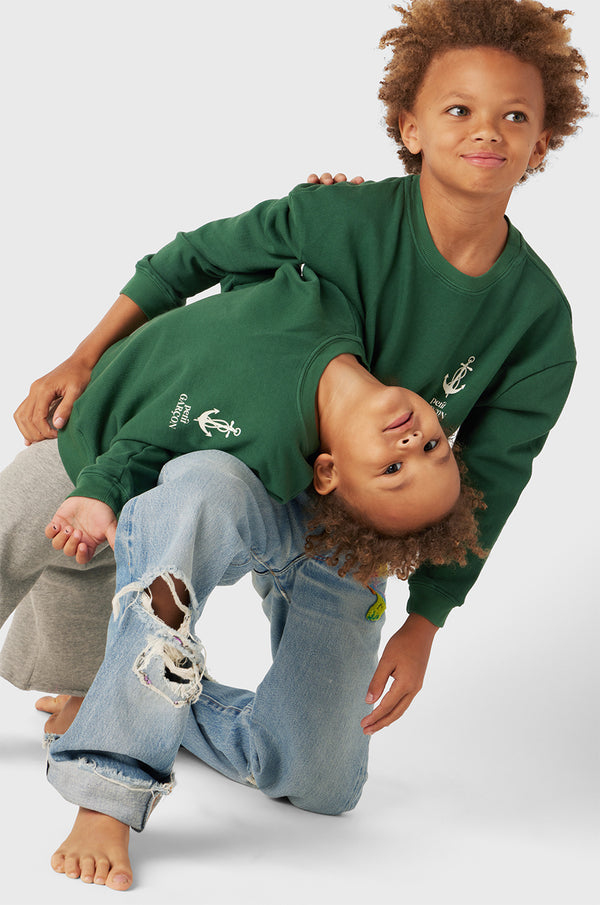 Model wearing Kids Petit Garçon Varsity Crewneck in Pine Organic Cotton little lady & petit sailor 