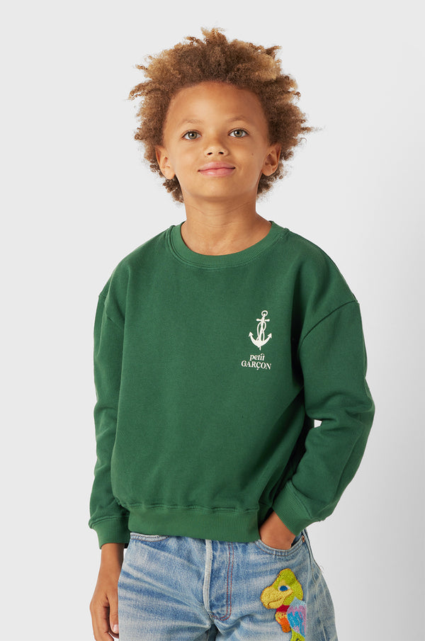 Model wearing Kids Petit Garçon Varsity Crewneck in Pine Organic Cotton little lady & petit sailor 