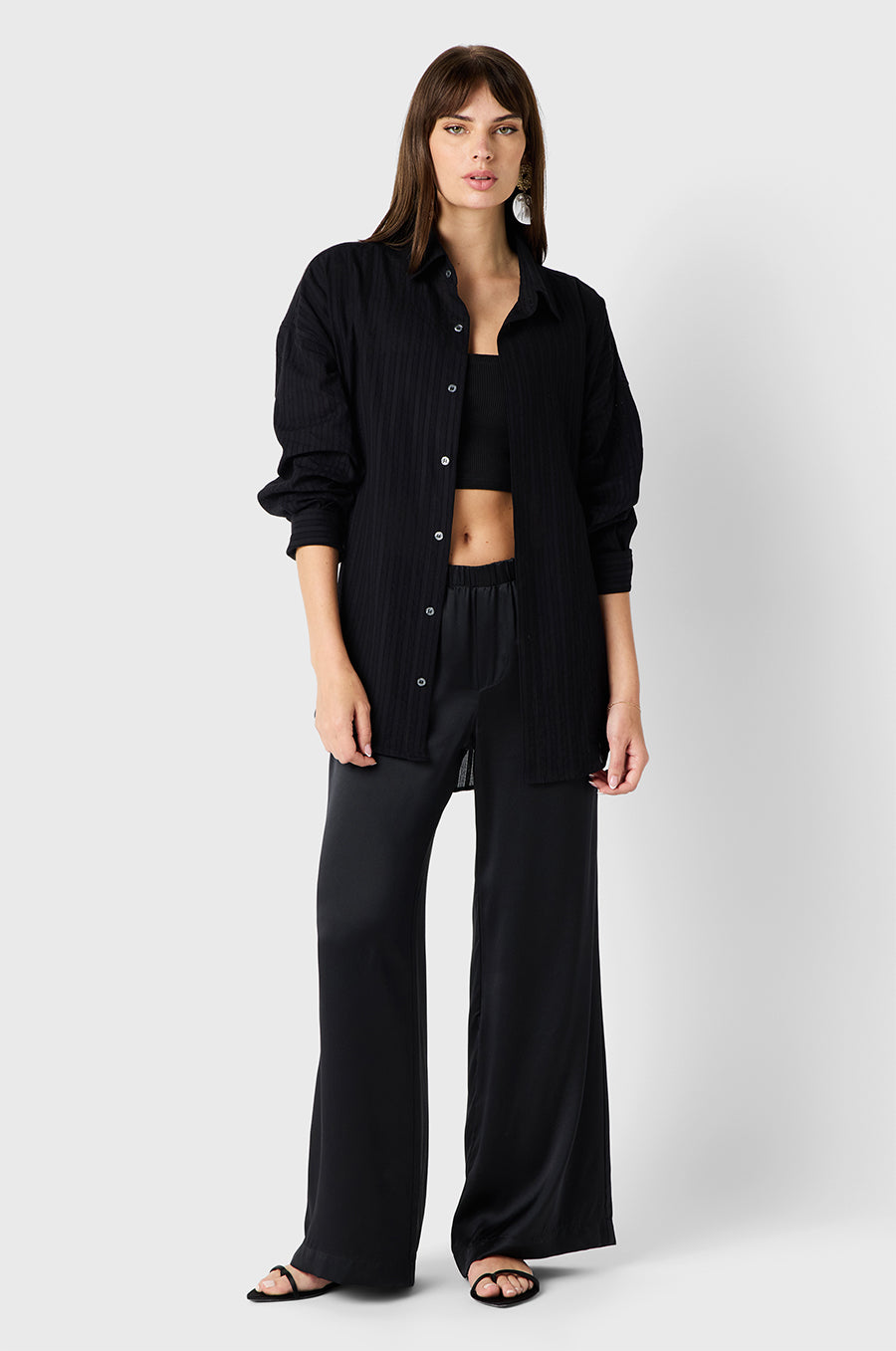 Brunette model wearing the lady & the sailor Wide Leg Pant in Black Silk