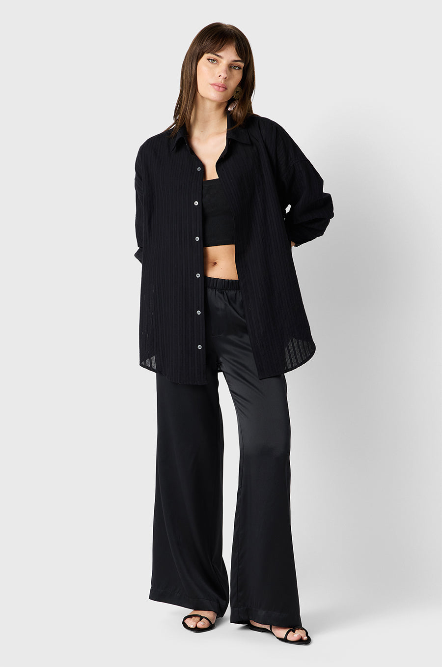 Brunette model wearing the lady & the sailor Wide Leg Pant in Black Silk