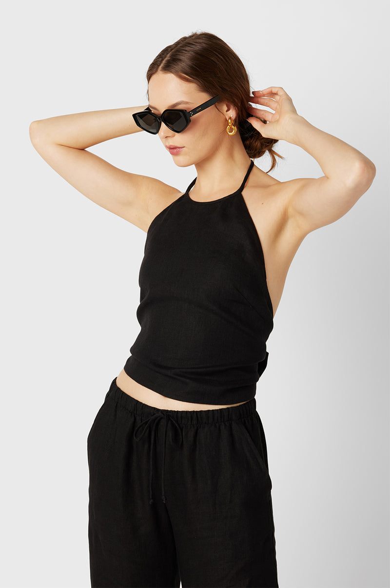 Model wearing the lady & the sailor Wrap Halter Top in Black Linen