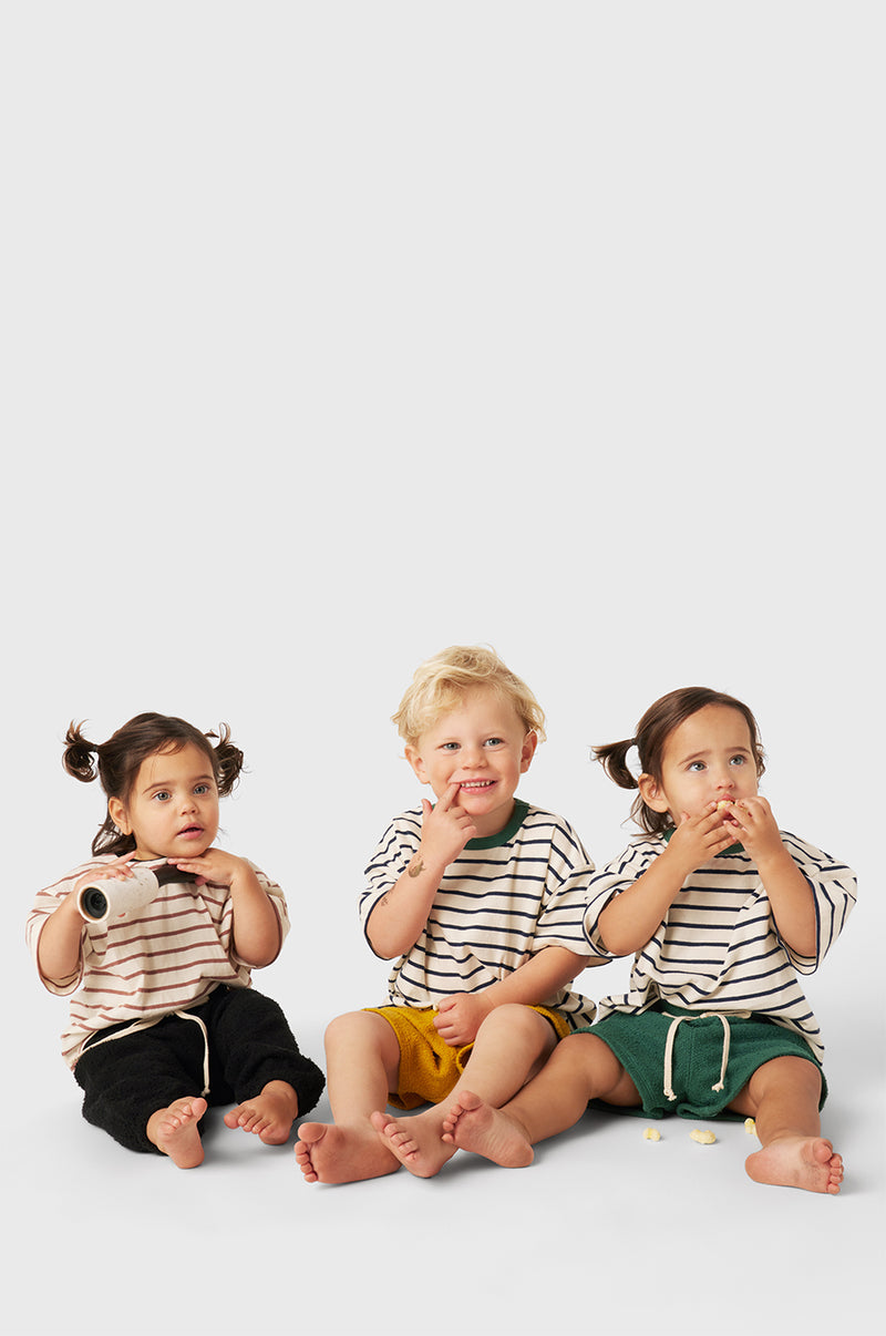 Model wearing Kids Weekend Short in Marigold Bouclé little lady & petit sailor