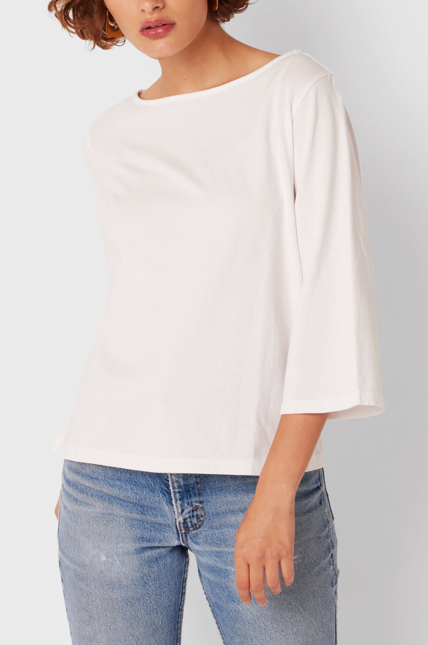Brunette Model wearing the lady & the sailor Breton Tee in White Vintage Cotton.