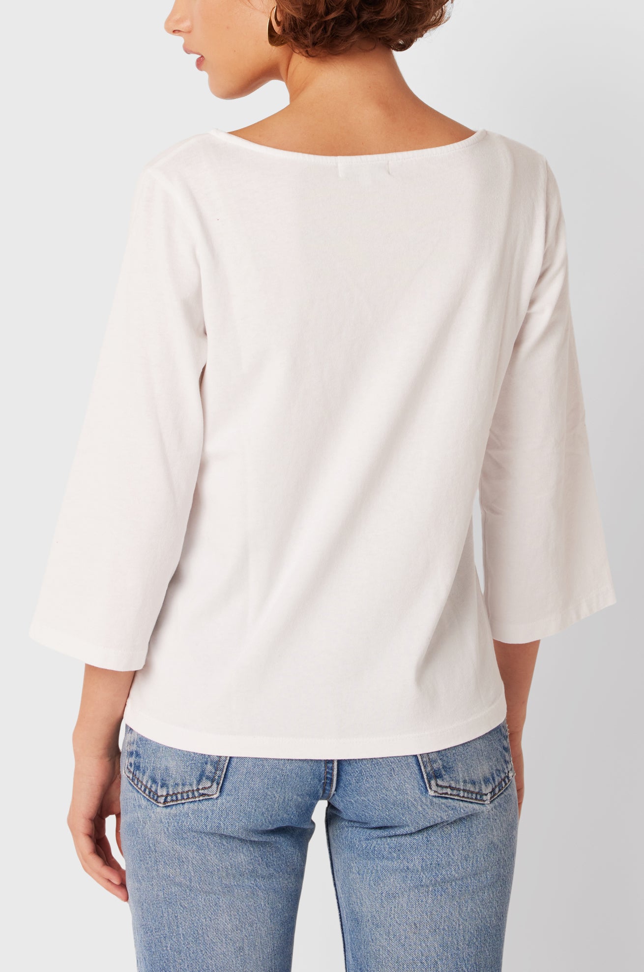 Brunette Model wearing the lady & the sailor Breton Tee in White Vintage Cotton.