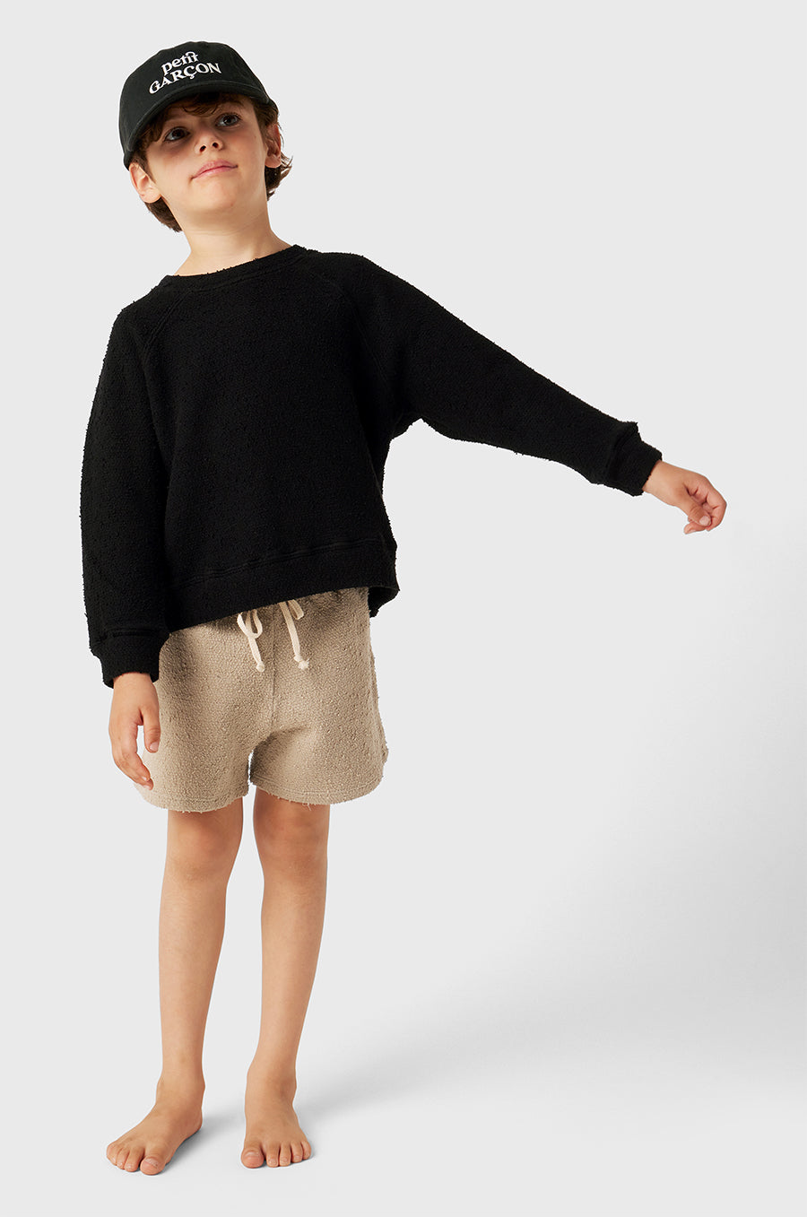 Model wearing Kids Weekend Short in Stone Bouclé little lady & petit sailor